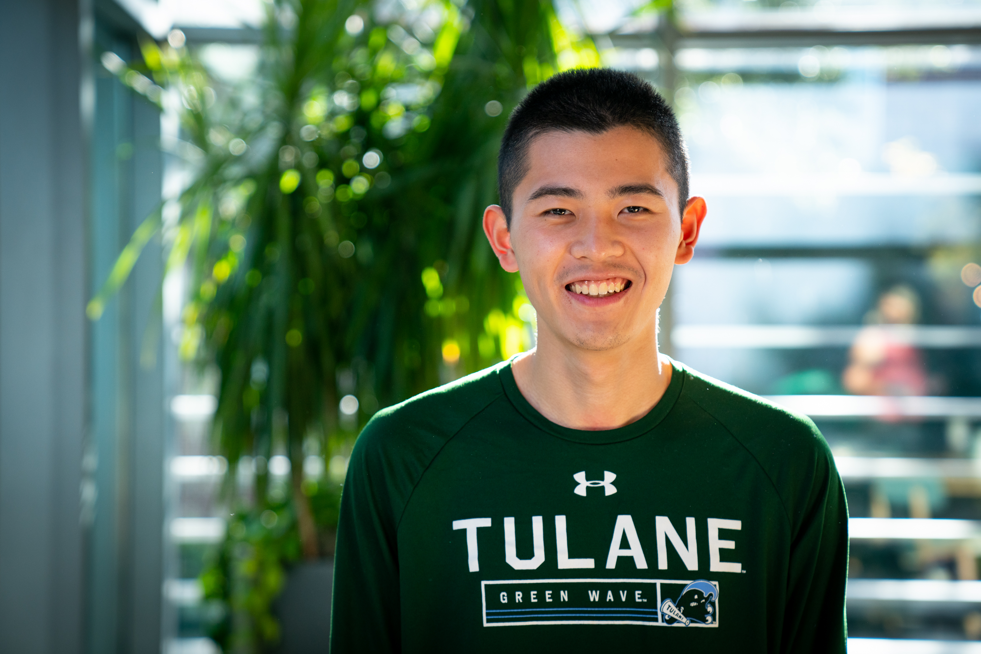 Short-haired man in green shirt