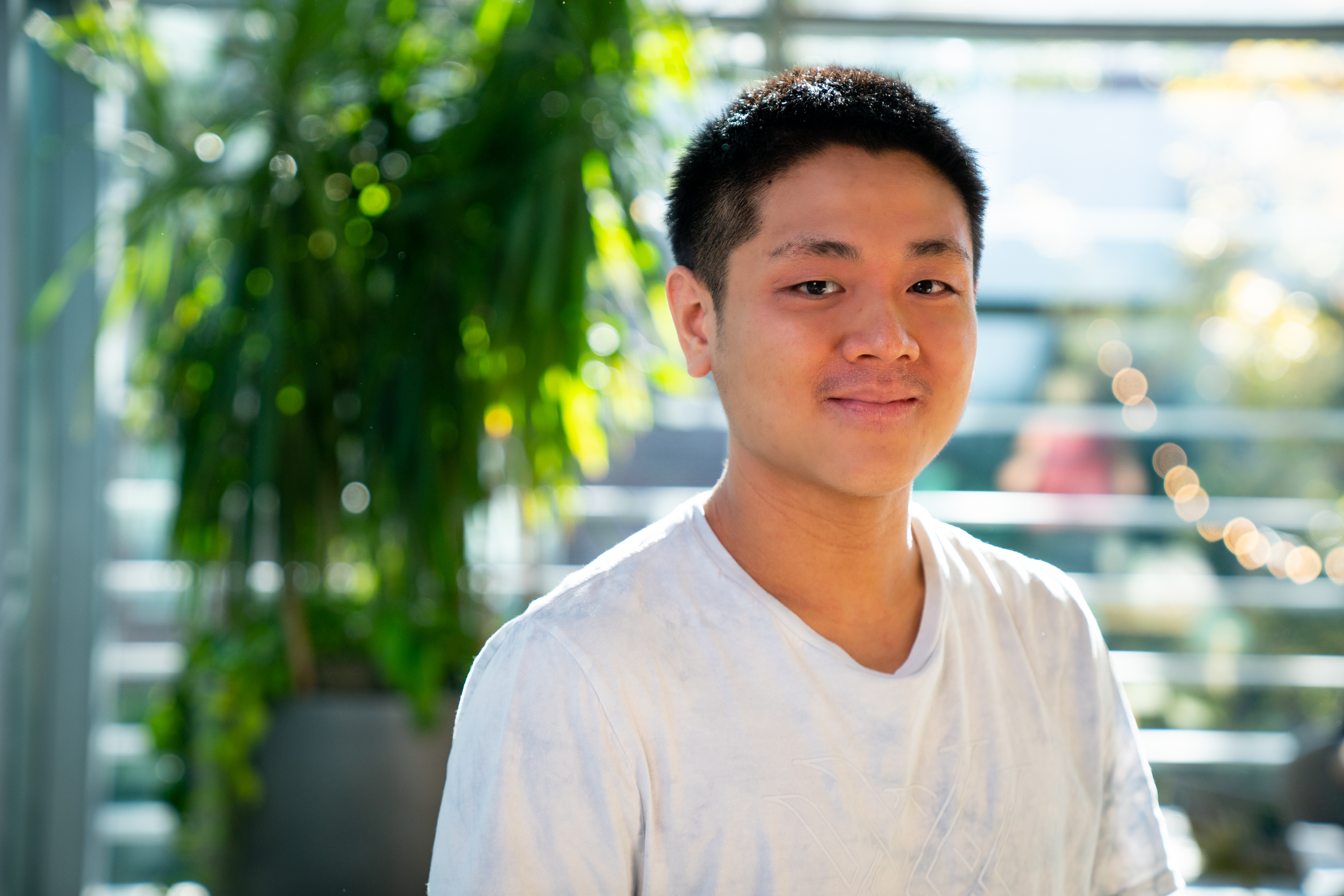 Short-haired man in white T-Shirt