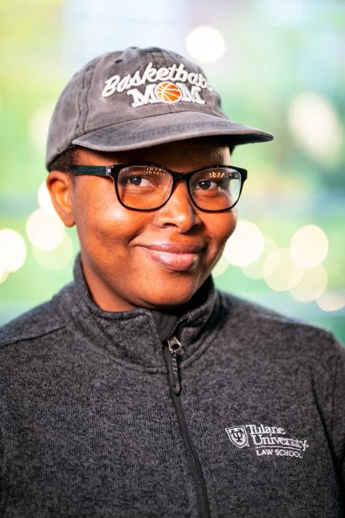 Women in grey cap and sweater smiling