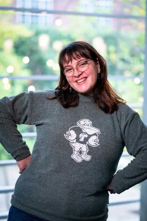 Women smiling in grey sweater